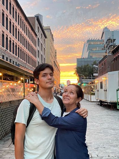 David and his mother on a San Francisco street at sunset